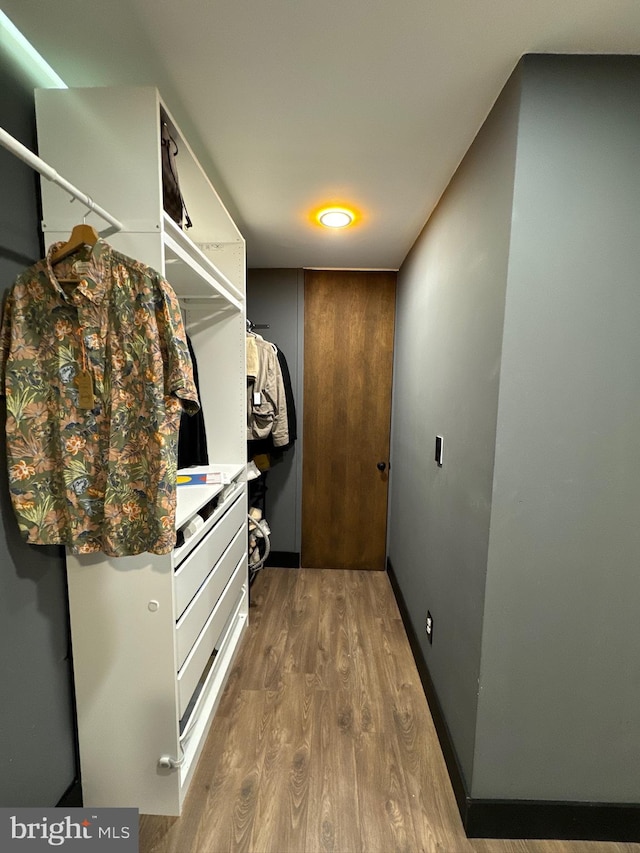 walk in closet featuring hardwood / wood-style floors