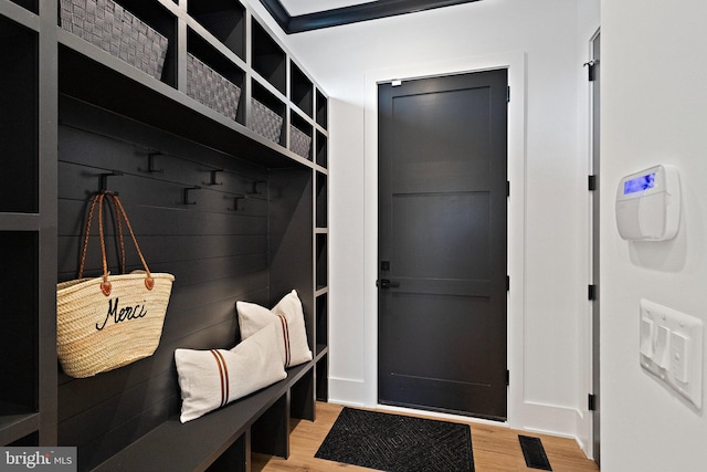 mudroom with light hardwood / wood-style flooring