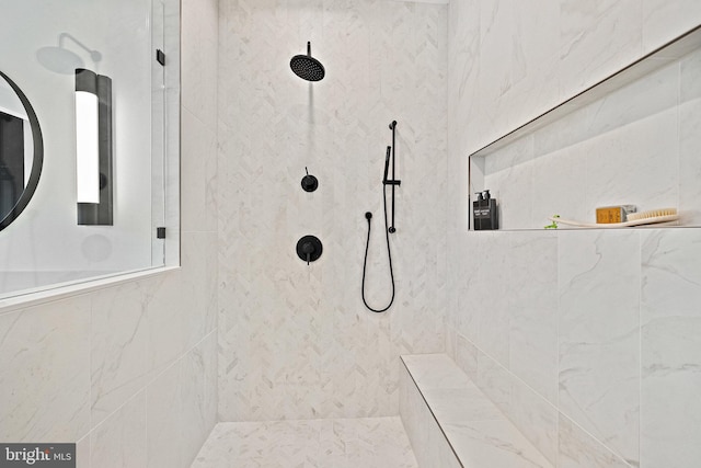 bathroom with tiled shower