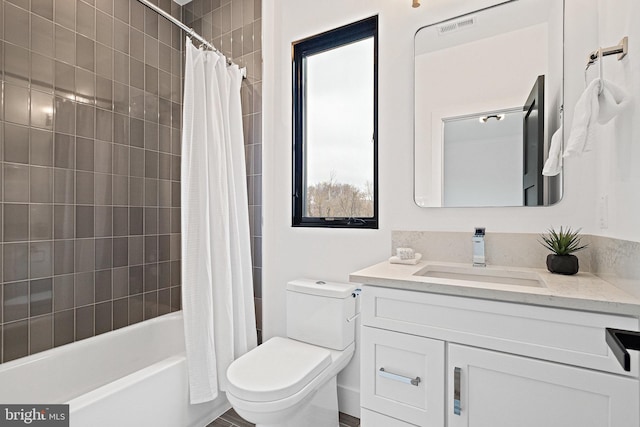 full bathroom featuring shower / tub combo, vanity, and toilet