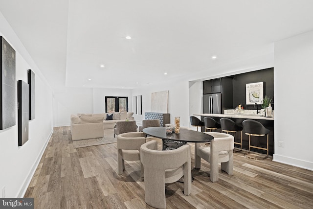 dining room with light wood-type flooring