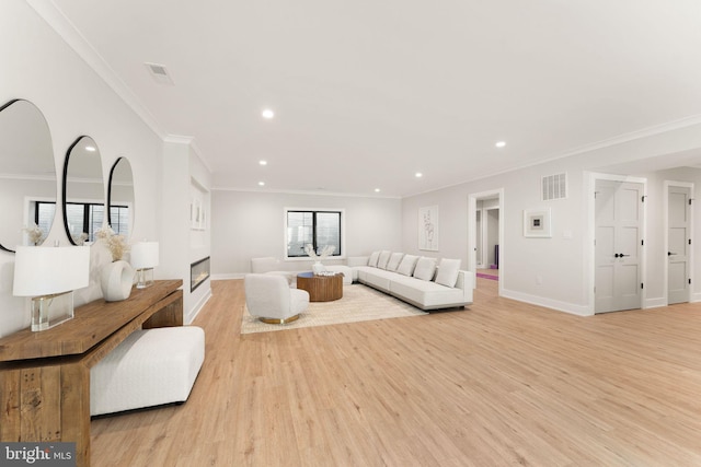 living room featuring crown molding and light wood-type flooring