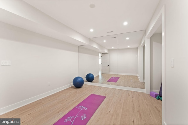 workout room featuring wood-type flooring