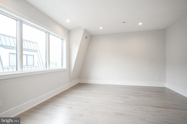 unfurnished room with light hardwood / wood-style flooring