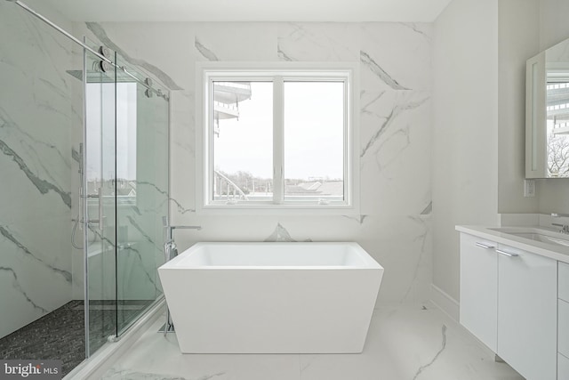 bathroom with separate shower and tub, vanity, and plenty of natural light