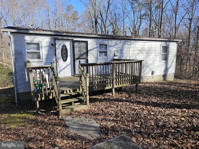 view of front of home featuring a wooden deck