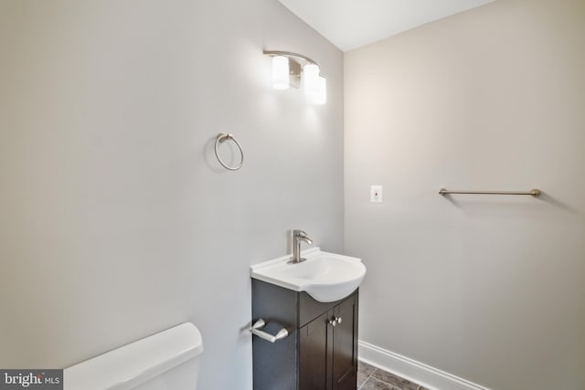 bathroom with tile patterned floors, toilet, and vanity