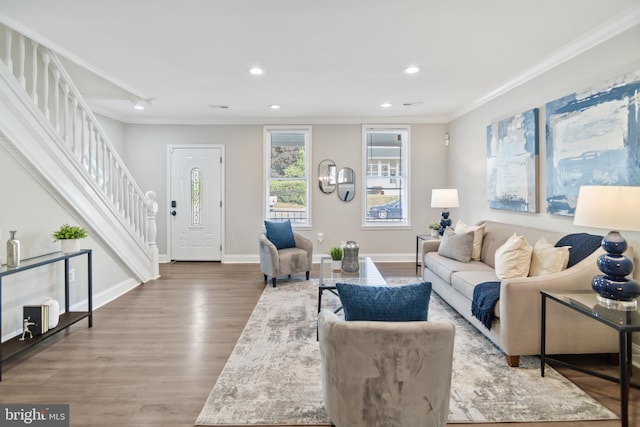 living room with crown molding and hardwood / wood-style flooring