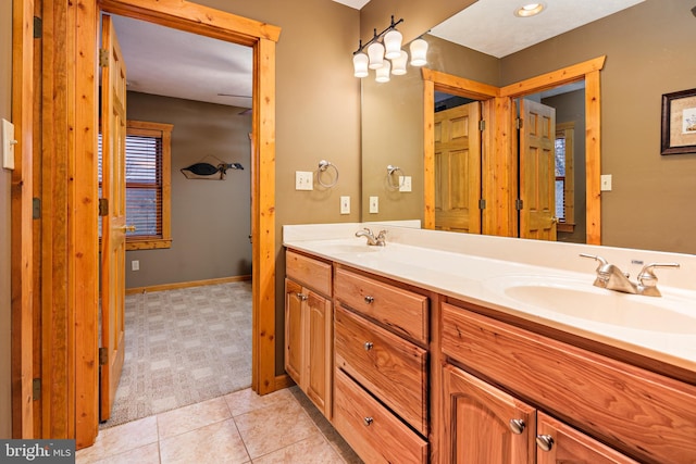 bathroom with tile flooring and dual vanity