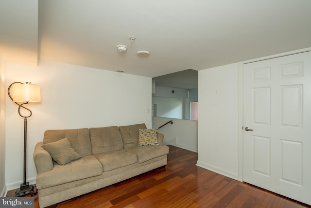 living room with dark hardwood / wood-style floors