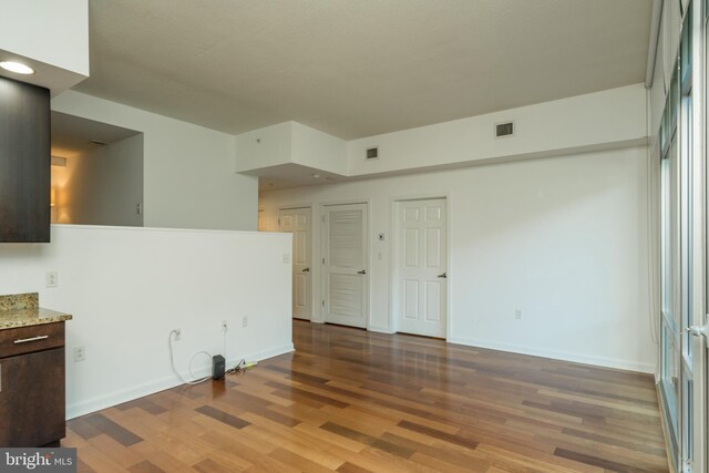 spare room featuring hardwood / wood-style floors