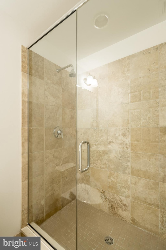 bathroom featuring an enclosed shower