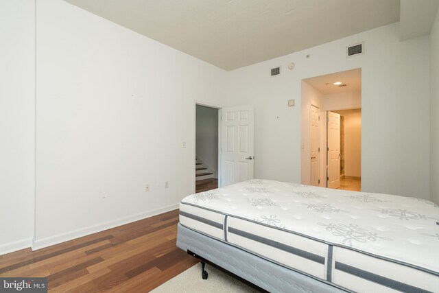 bedroom featuring hardwood / wood-style flooring