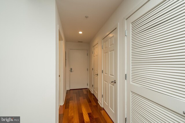 hallway featuring dark wood-type flooring