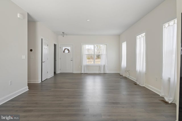 empty room featuring dark hardwood / wood-style flooring