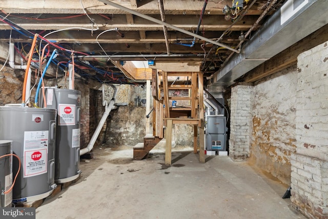 basement featuring heating unit and water heater