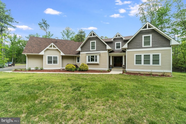 craftsman-style home featuring a front lawn