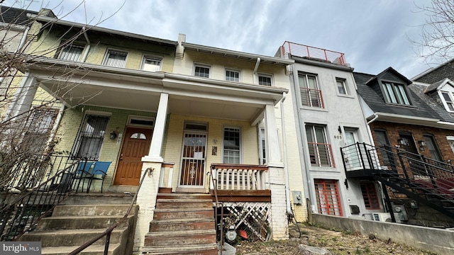 view of property with covered porch