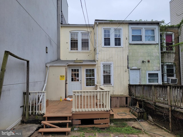 rear view of property with a deck