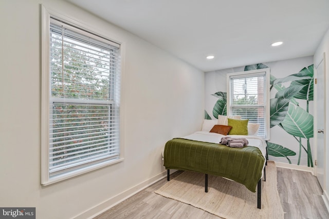 bedroom with light hardwood / wood-style flooring