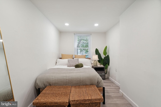 bedroom with light hardwood / wood-style floors