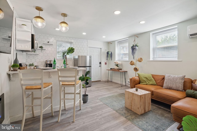 living room with light hardwood / wood-style floors