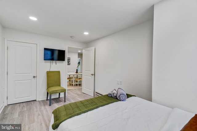 bedroom with light hardwood / wood-style flooring