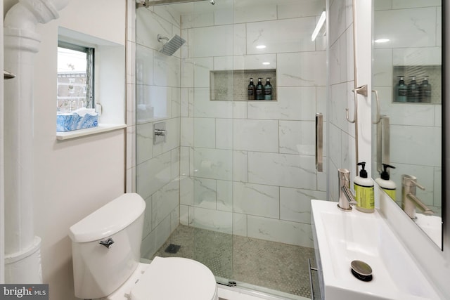 bathroom with an enclosed shower and toilet