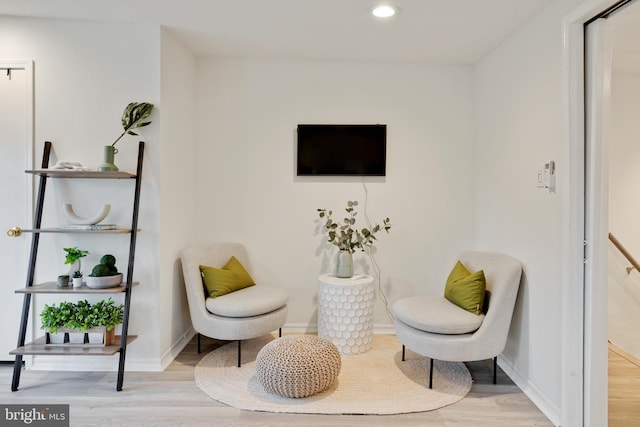 sitting room with light hardwood / wood-style flooring