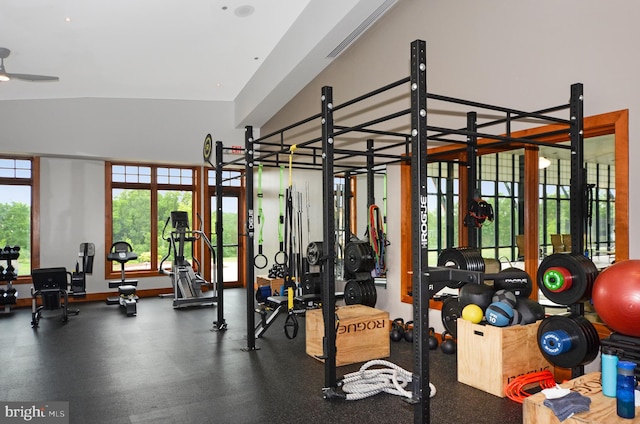 workout area with ceiling fan and lofted ceiling