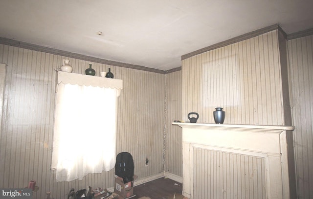 interior space featuring a healthy amount of sunlight, dark hardwood / wood-style floors, and crown molding
