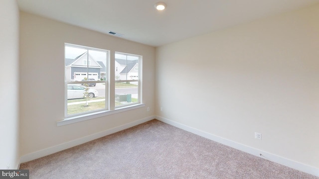 unfurnished room featuring carpet flooring