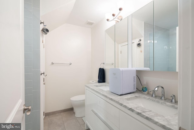 bathroom featuring dual sinks, tile floors, toilet, and oversized vanity