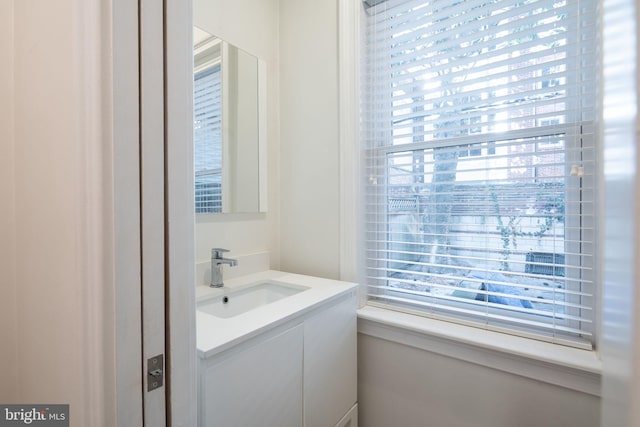 bathroom with plenty of natural light and vanity