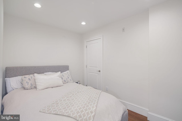 bedroom featuring wood-type flooring