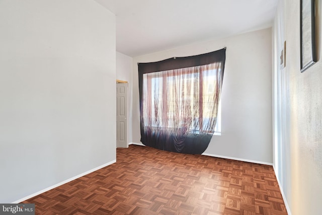 empty room featuring dark parquet floors