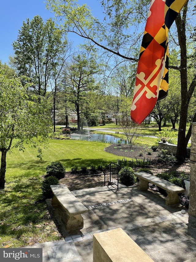 view of patio / terrace featuring a water view