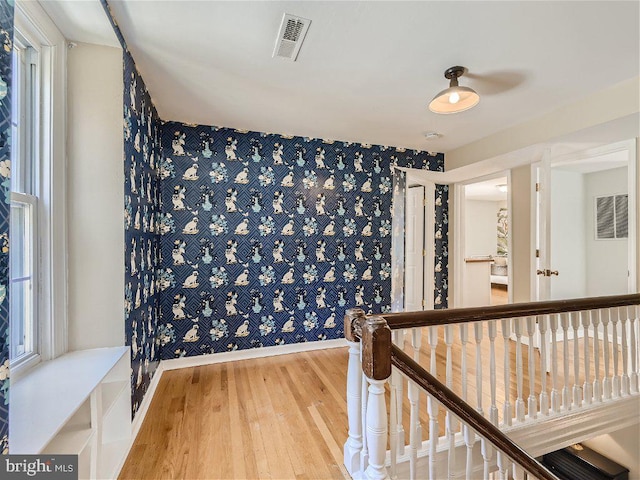 corridor featuring light hardwood / wood-style flooring