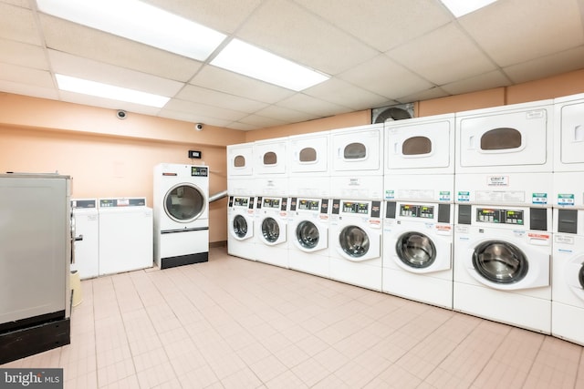 laundry room with stacked washer / dryer and washer and dryer