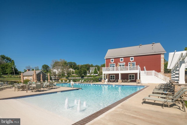 view of swimming pool featuring a patio area