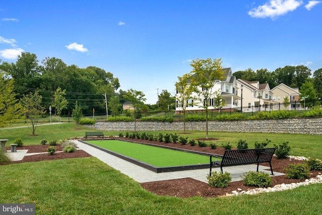 view of property's community featuring a lawn