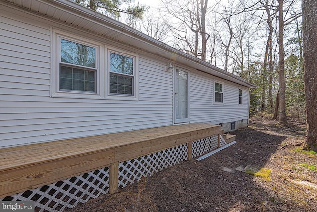 view of home's exterior with a deck