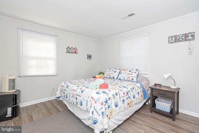 bedroom with hardwood / wood-style floors