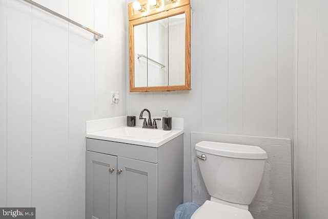 bathroom featuring oversized vanity and toilet