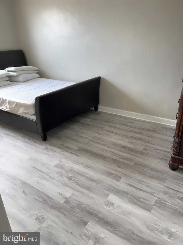 bedroom with light wood-type flooring