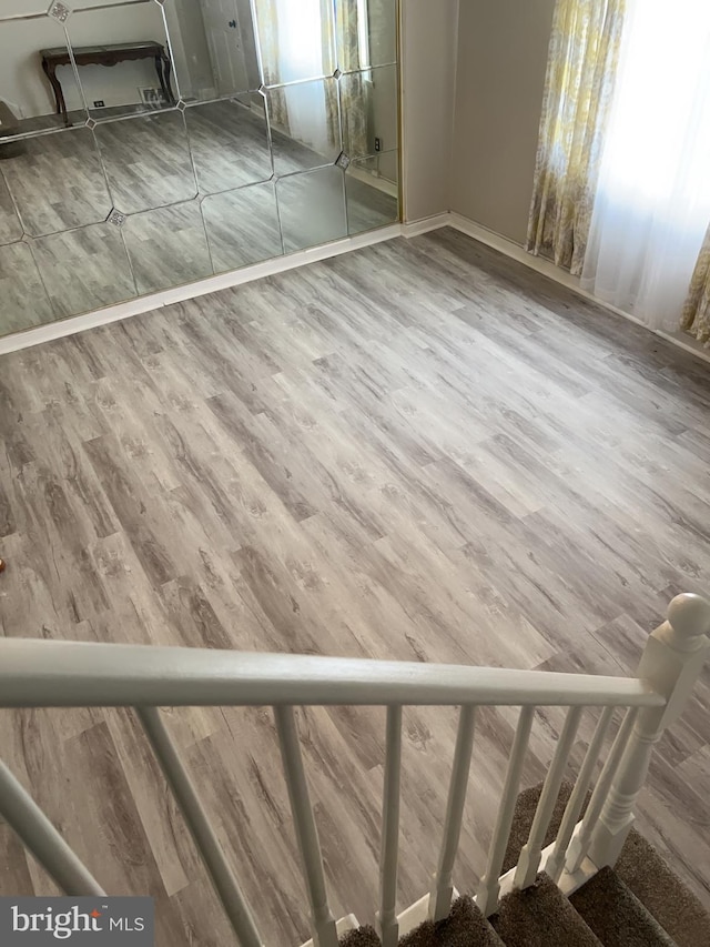 unfurnished bedroom with wood-type flooring