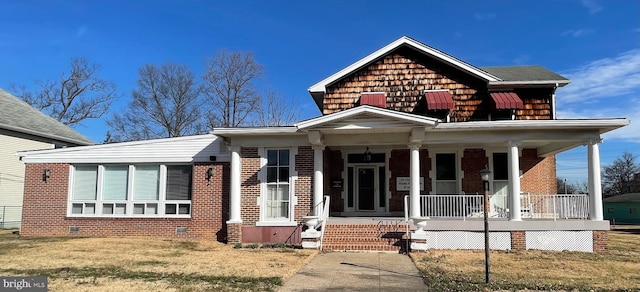 view of front of home with covered porch and a front yard