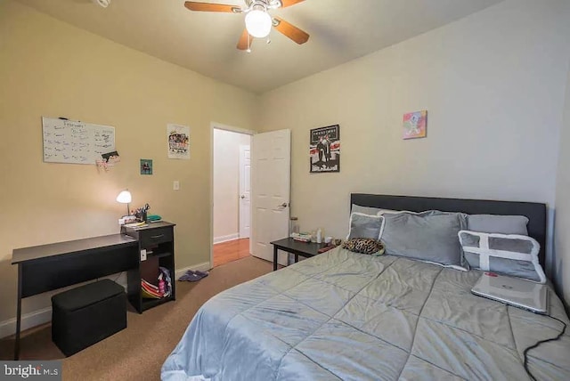 carpeted bedroom with ceiling fan