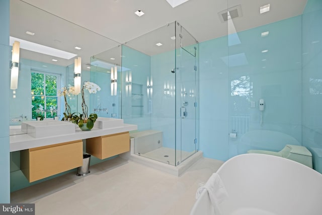 bathroom featuring vanity and separate shower and tub