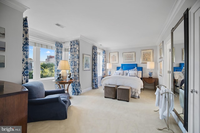 bedroom with crown molding and light carpet